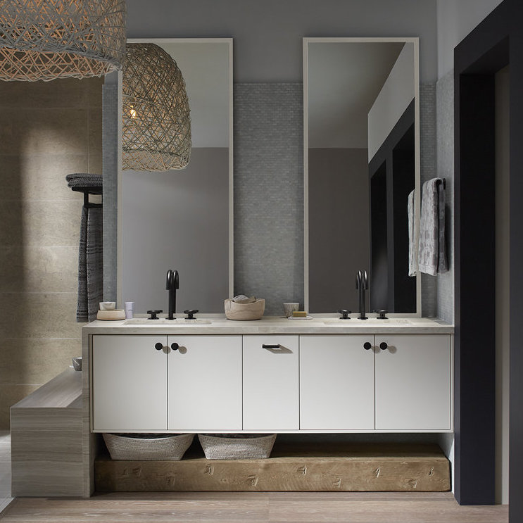 bathroom with two sinks and tall mirrors